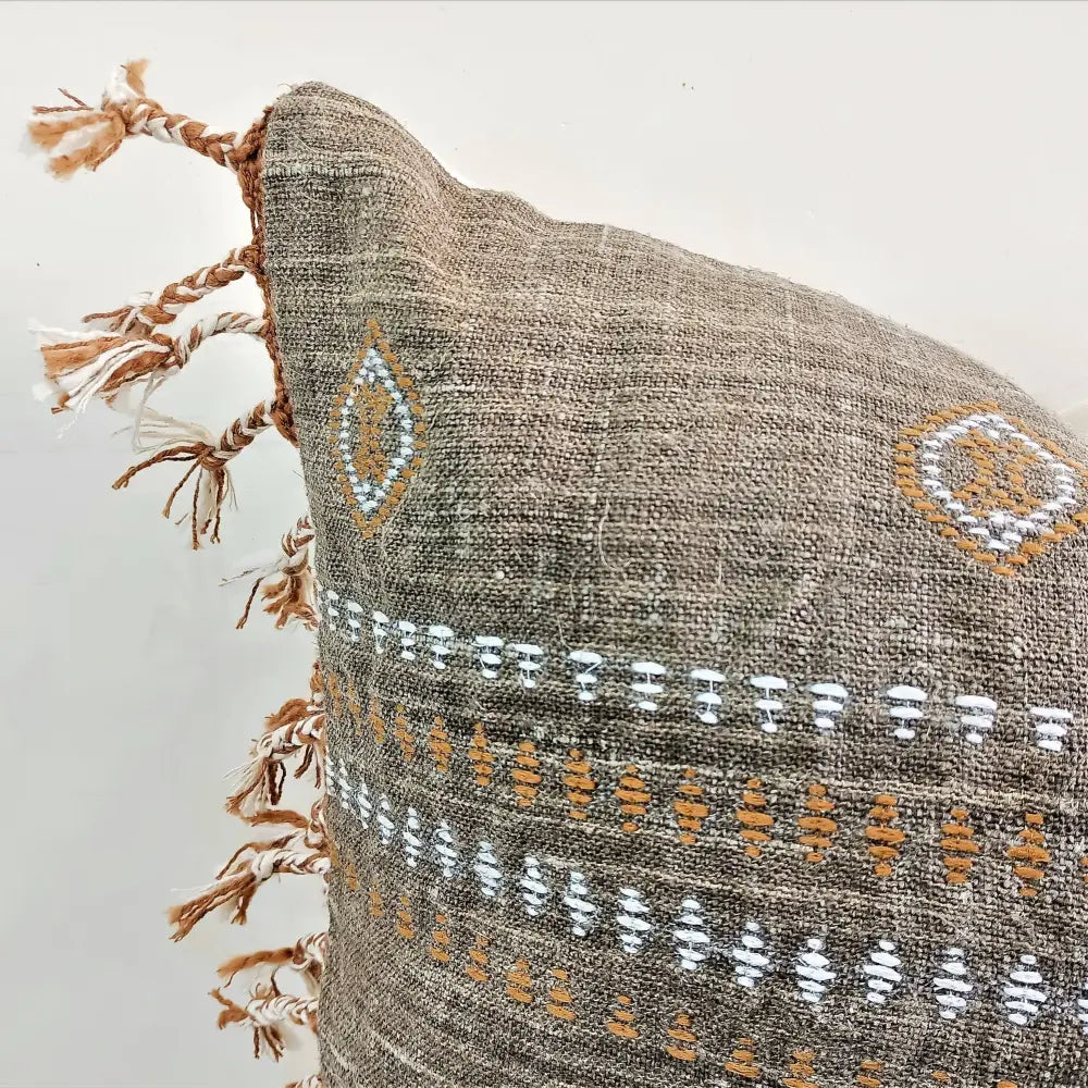 Throw pillow cover size 20 inch x 20 inch with rough linen texture, tassels, and hand embroidered accents.
