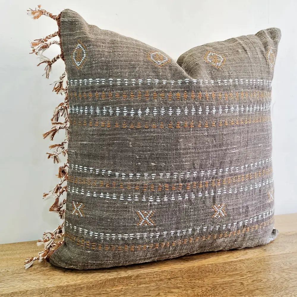 Throw pillow cover size 20 inch x 20 inch with rough linen texture, tassels, and hand embroidered accents.