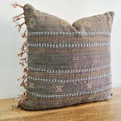 Throw pillow cover size 20 inch x 20 inch with rough linen texture, tassels, and hand embroidered accents.