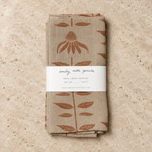 Beige linen napkins with rust echinacea designs and artisan hand carved stamp designs in white label band set of 2