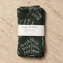 Dark green linen napkins with subtle light gray fern designs packaged in white label band artisan designed set of 2