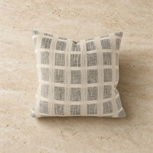 A linen pillow cover with a textured neutral-toned grid pattern in beige and gray tones perfect as a checked pillow cover