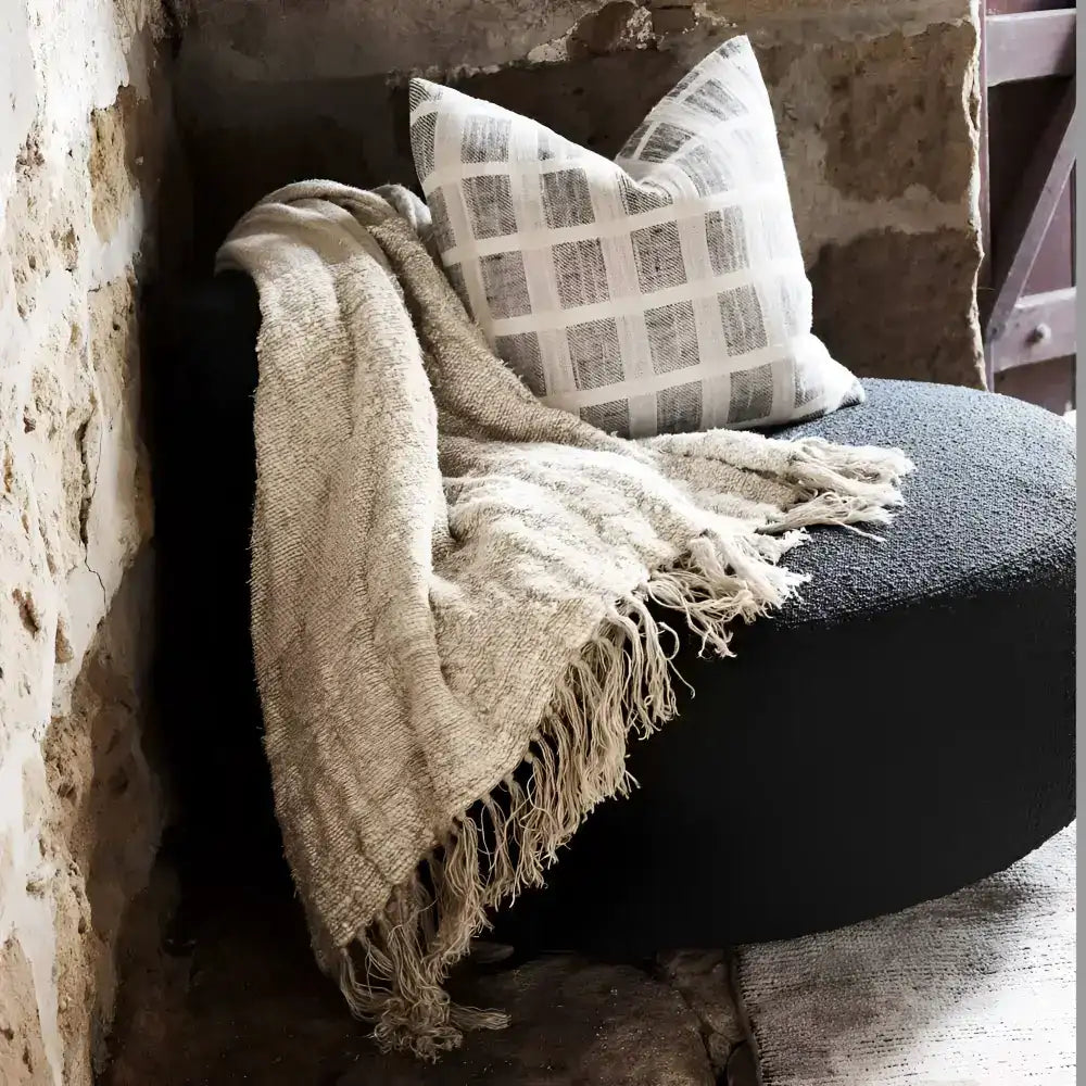 Linen pillow cover with grid design in off-white and slate colors.
