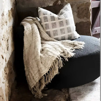 Linen pillow cover with grid design in off-white and slate colors.