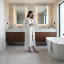 Person in everyday linen robe with fine stripes in European linen