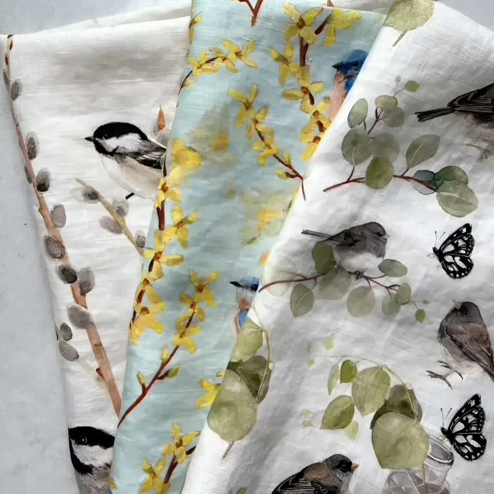 Set of three fabric swatches with nature-themed patterns on a light gray background