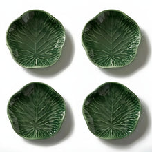 Green lotus leaf-shaped ceramic salad plates with embossed veins and glossy finish
