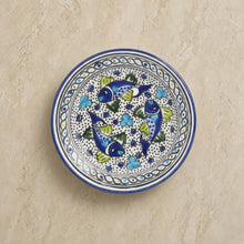 Mediterranean blue fish side plate with hand-painted blue fish green fins and colorful mandala-like patterns on ceramic