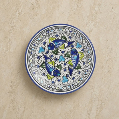 Mediterranean blue fish side plate with hand-painted blue fish green fins and colorful mandala-like patterns on ceramic