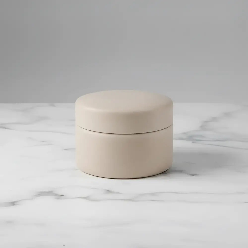 Beige ceramic round jar with matching lid from mindful moments candle set lotus blossom and agave