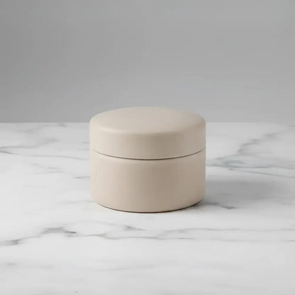 Beige ceramic round jar with matching lid from mindful moments candle set lotus blossom and agave