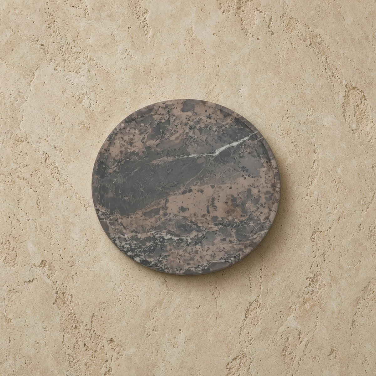 Circular soapstone plate with dark gray and brown veins in mini smudge nest curated set discover rookery nests