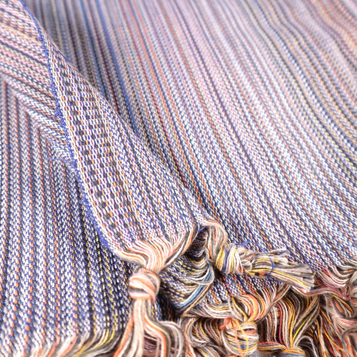 Colorful Turkish beach towel with stripes and tassels, perfect as a sand free beach towel