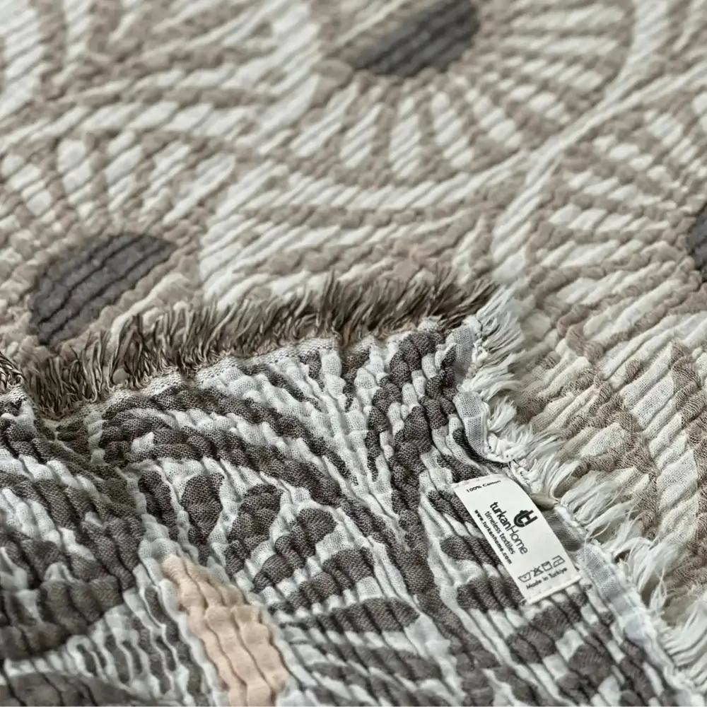 Soft Turkish muslin bed blanket with ginko design and fringed edges