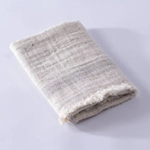 Light gray double-sided muslin hand towel with eyelash fringe ends. 