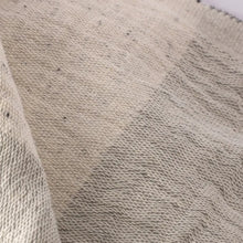 Light gray double-sided muslin hand towel with eyelash fringe ends. 