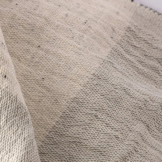 Light gray double-sided muslin hand towel with eyelash fringe ends. 