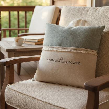 Handmade green linen reading pillow with my day is booked embroidery