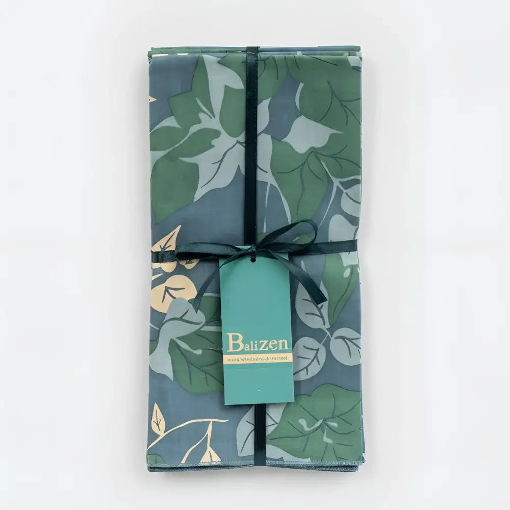 A fair trade napkins blue and green floral set with botanical leaf pattern on dark teal fabric from bali workshop