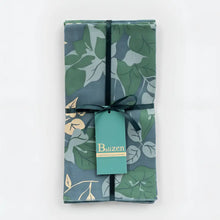 A fair trade napkins blue and green floral set with botanical leaf pattern on dark teal fabric from bali workshop