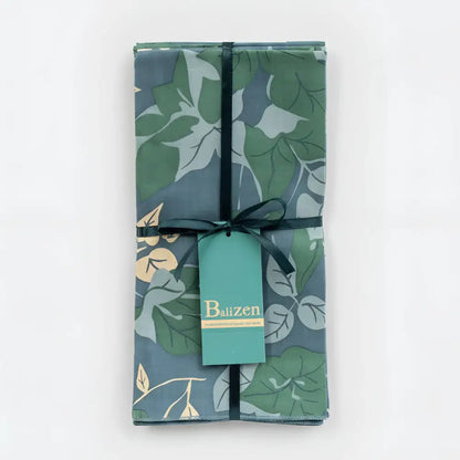 A fair trade napkins blue and green floral set with botanical leaf pattern on dark teal fabric from bali workshop