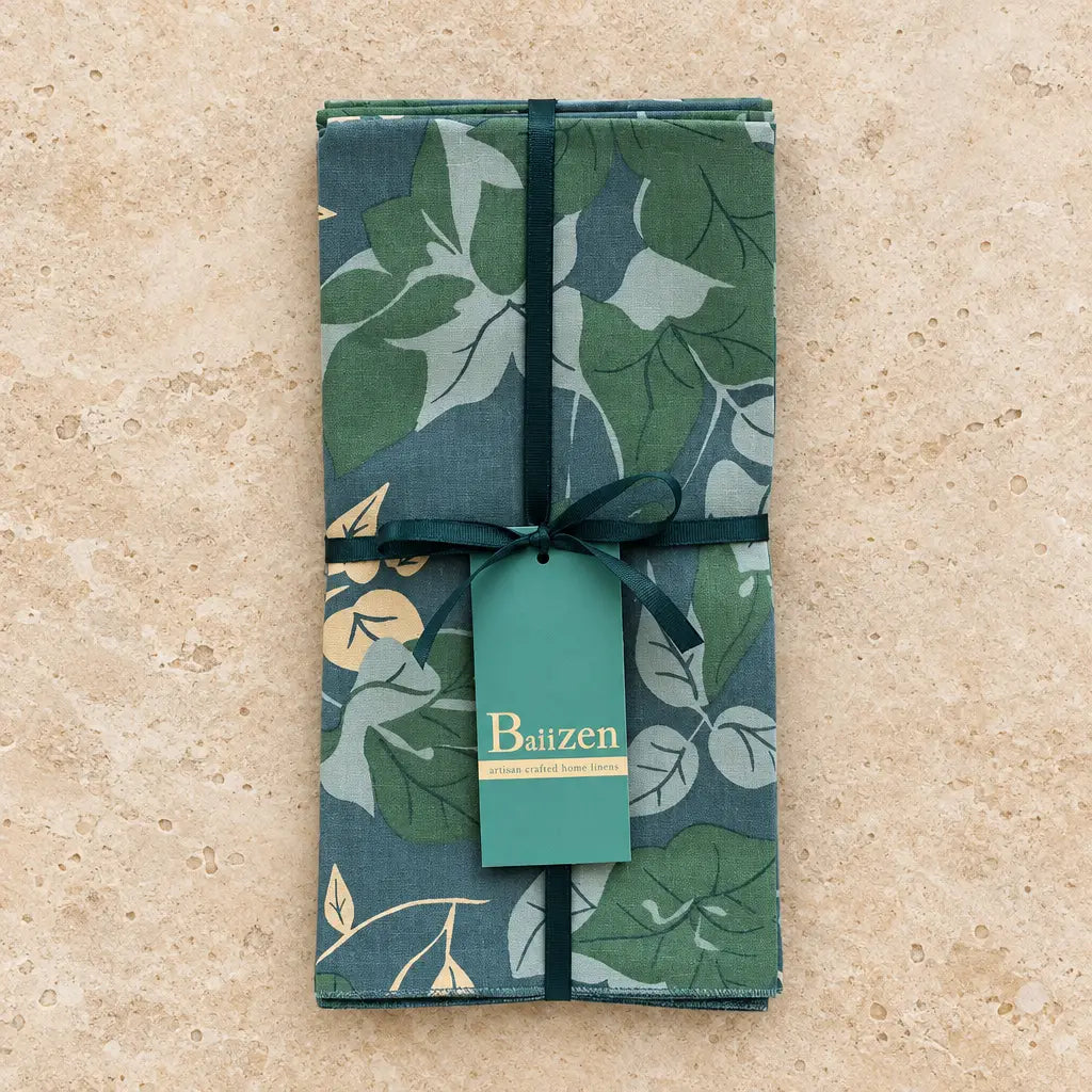 Set of 4 green and blue floral napkins made of absorbent cotton hand silk-screened in a fair-trade bali workshop tied with ribbon