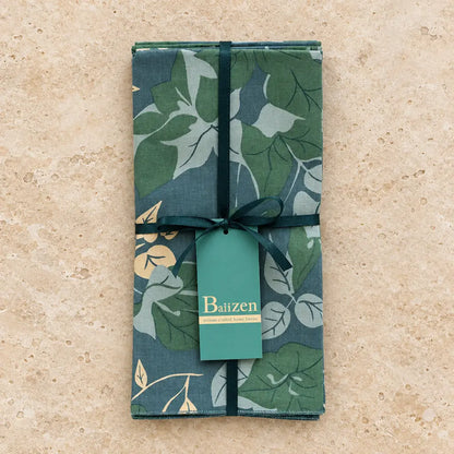 Set of 4 green and blue floral napkins made of absorbent cotton hand silk-screened in a fair-trade bali workshop tied with ribbon