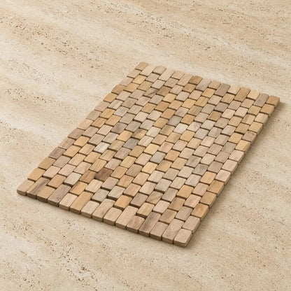 Natural teak placemats made from recycled teak pieces featuring interlocking light brown and beige wood tiles
