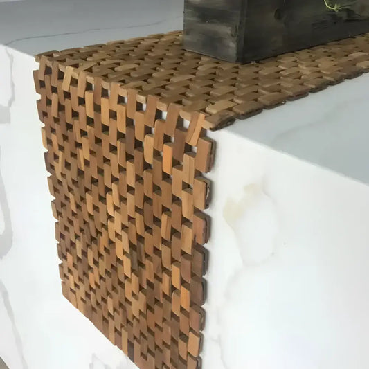 Flexible woven wooden table runner made from recycled teak pieces for natural teak table decor