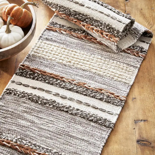 textured table runner in natural multicolors on a wooden surface