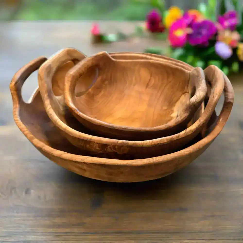 Rustic Teak Bowl with Handles set of three stacked on wooden table with flowers in background