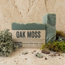 A pale green rectangular oak moss bar soap with purifying french green clay and natural lichen accents