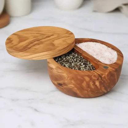 Handcrafted olive wood dual compartment spice cellar with warm finish and swiveling magnetic lid for easy use