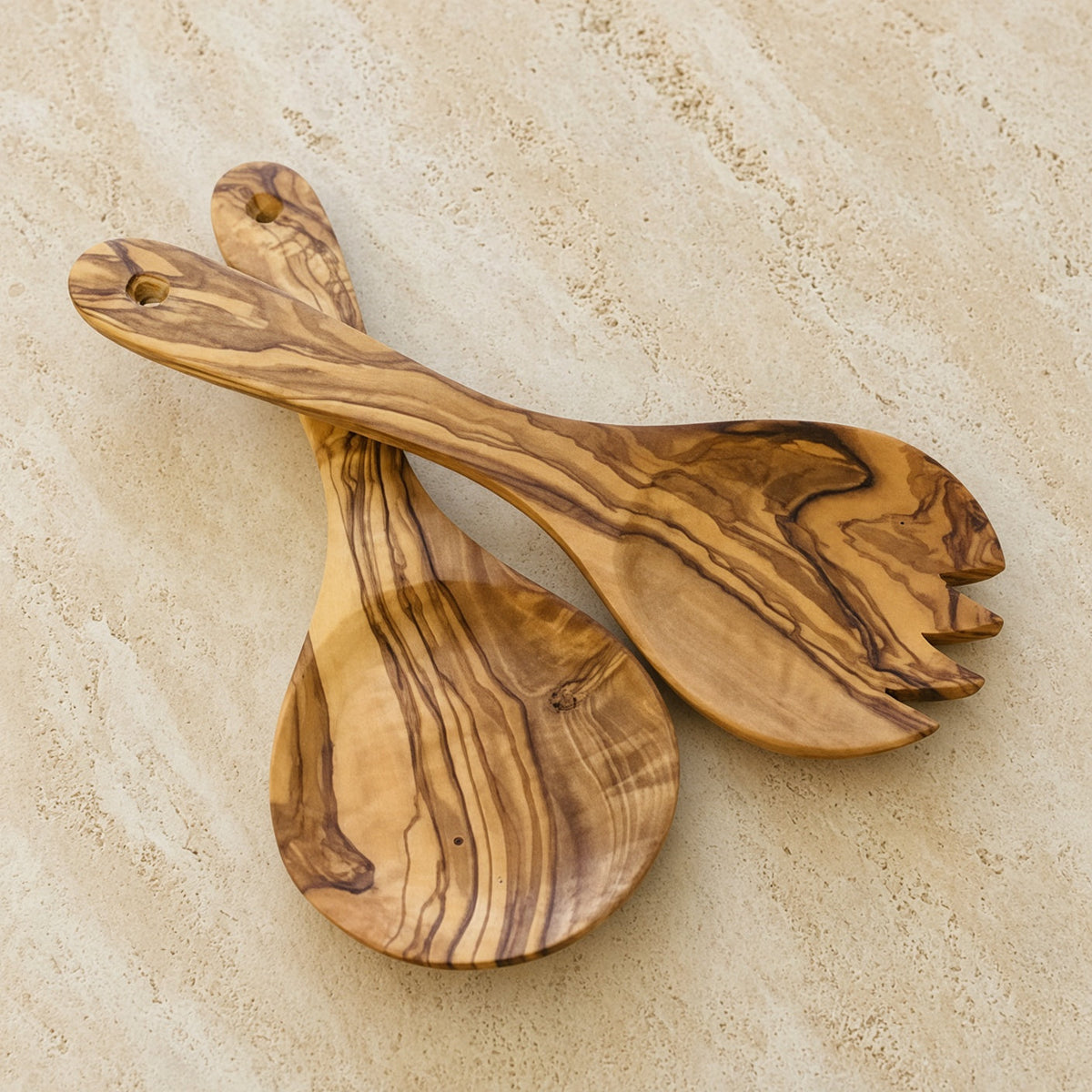 Hand carved olive wood salad server and spoon set with warm golden brown swirling grain perfect for olive wood serving