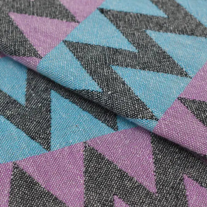 Organic bath towel with bold purple teal and black zigzag pattern perfect for beach and bath use