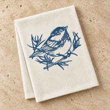Beige organic cotton chickadee kitchen towel with navy original chickadee design on branches for everyday use