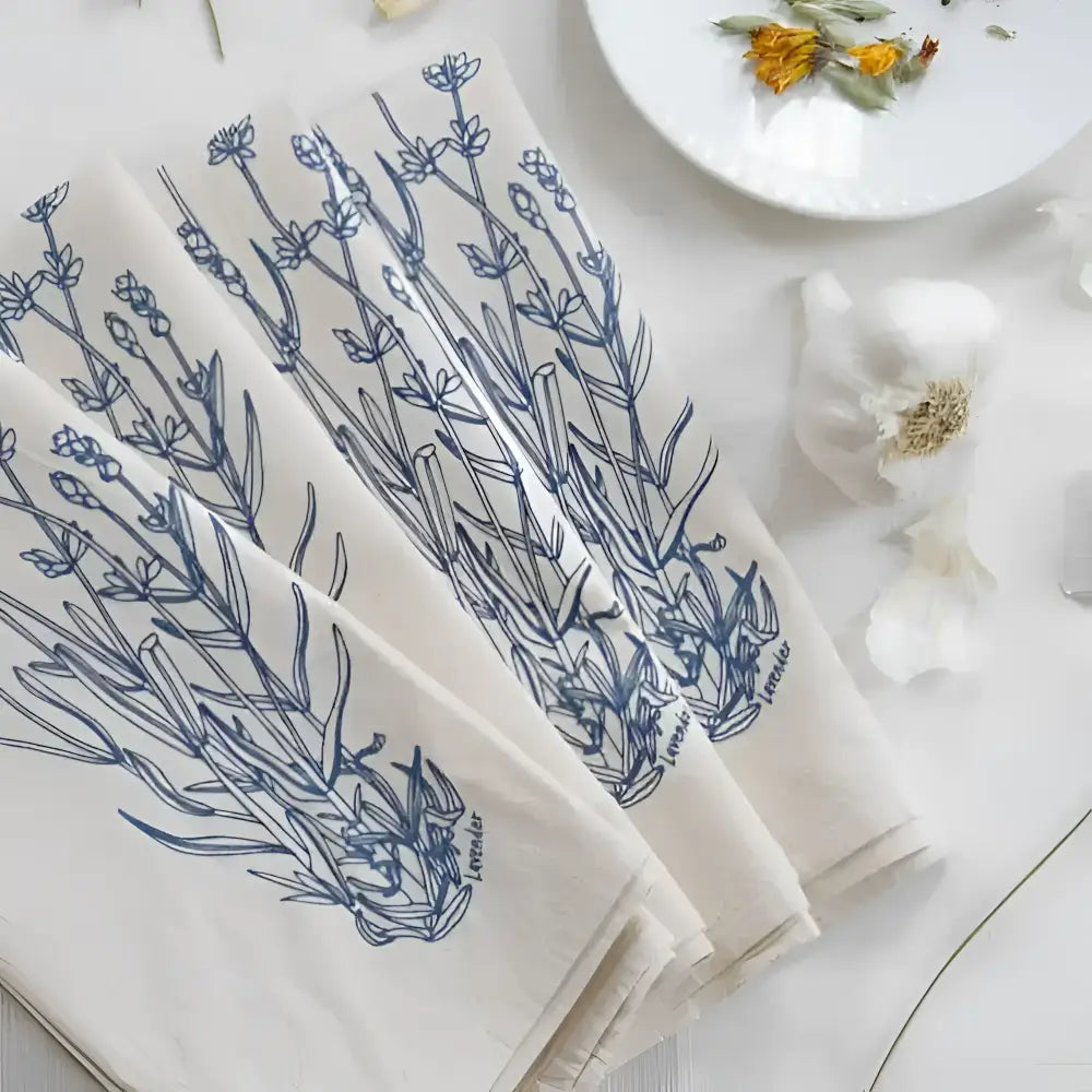 A set of four natural organic cotton napkins, hand-printed with an original Lavender print in blue-violet.