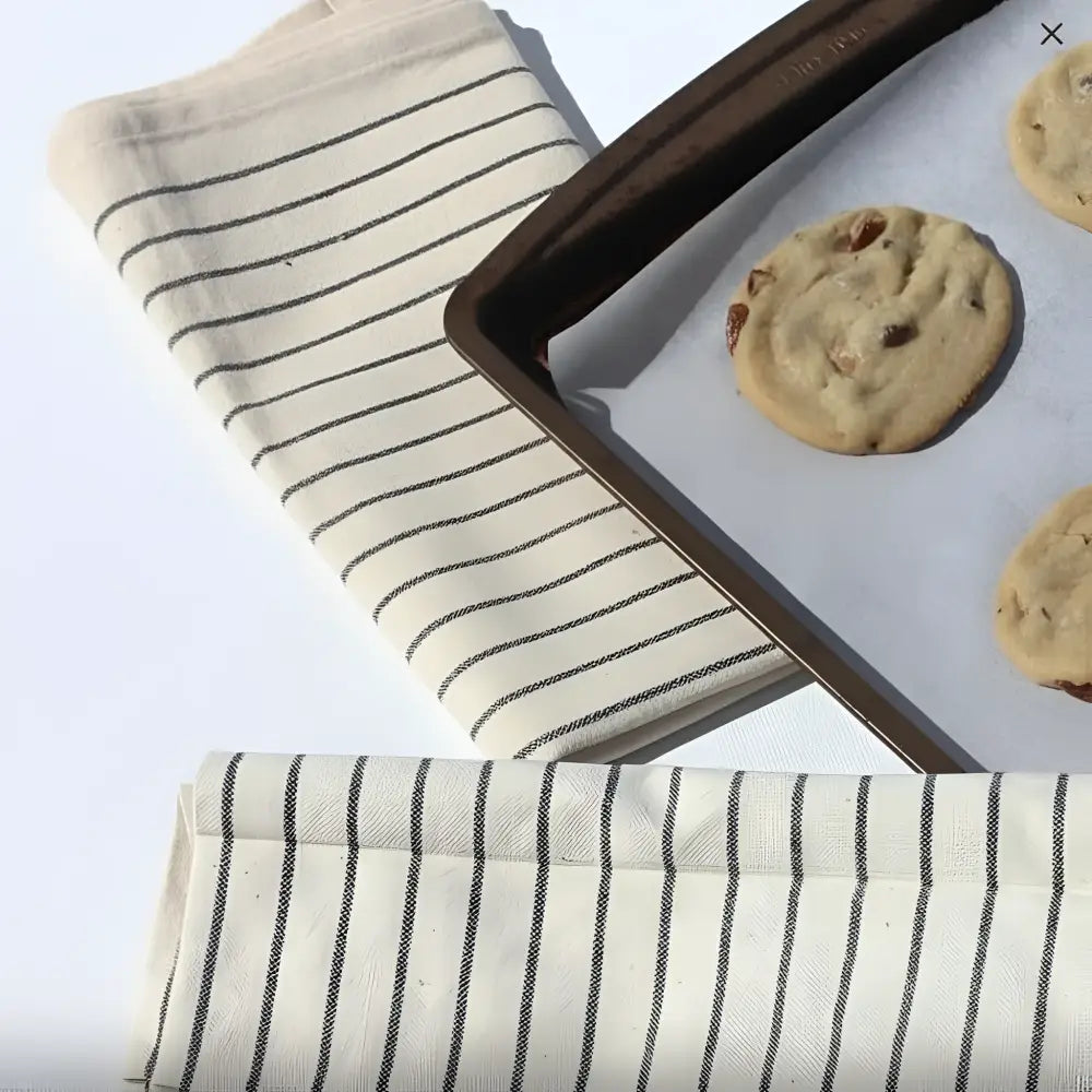 Striped black and white organic cotton tea towel with wearable apron