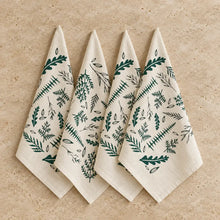 Set of four cream-colored organic cotton woodland fern napkins with dark green and black original woodland ferns print