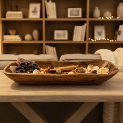 Decorative wooden bowl filled with potpourri made from salvaged teak root