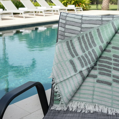 Reversible Turkish towel with abstract pattern, fringed edges, quick drying, sand resistant
