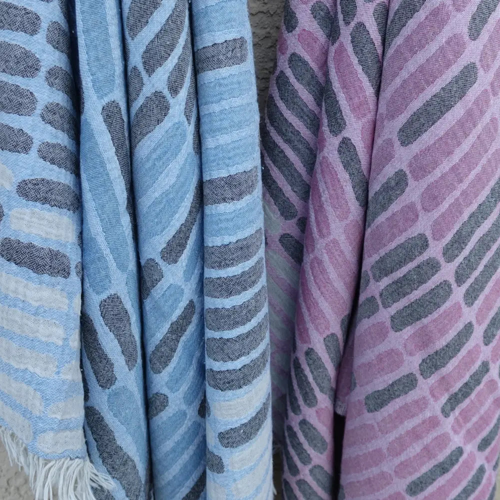 Three patterned Turkish towels in blue and pink, quick drying and sand resistant