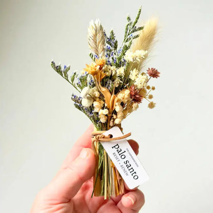 Handmade eco-friendly Palo Santo + Flora dried floral arrangement in beige, cream, purple hues with twine bow