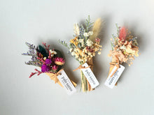 Three handmade palo santo floral bouquets with twine ties