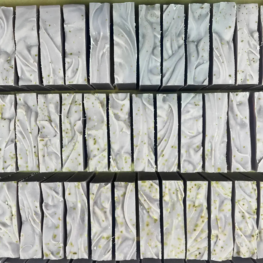 Rows of passionflower soothing aromatic bar soap with ylang ylang, soothing organic oats, and passion fruit seed flecks