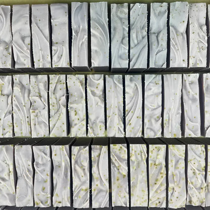 Rows of passionflower soothing aromatic bar soap with ylang ylang, soothing organic oats, and passion fruit seed flecks
