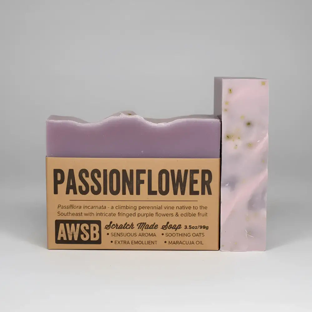 Purple passionflower bar soap with ylang ylang and passion fruit seed wrapped in kraft paper by awsb scratch made soap