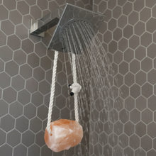 Small pink Himalayan salt rock on chrome showerhead rope