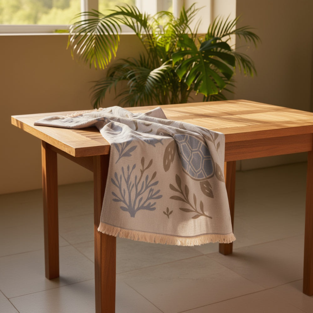 Light blue and beige turkish cotton beach towel with ocean-themed embroidery perfect as a playground sand repellent beach blanket