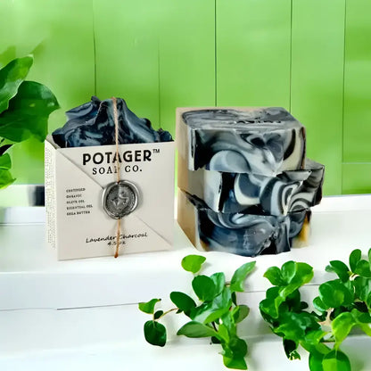 Lavender charcoal soap bars with swirled black and white pattern, perfect for Feathers Short Robe gift set